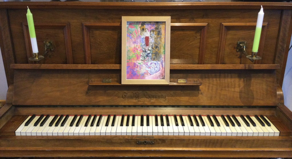 Piano with art by Mette Munch on the music stand